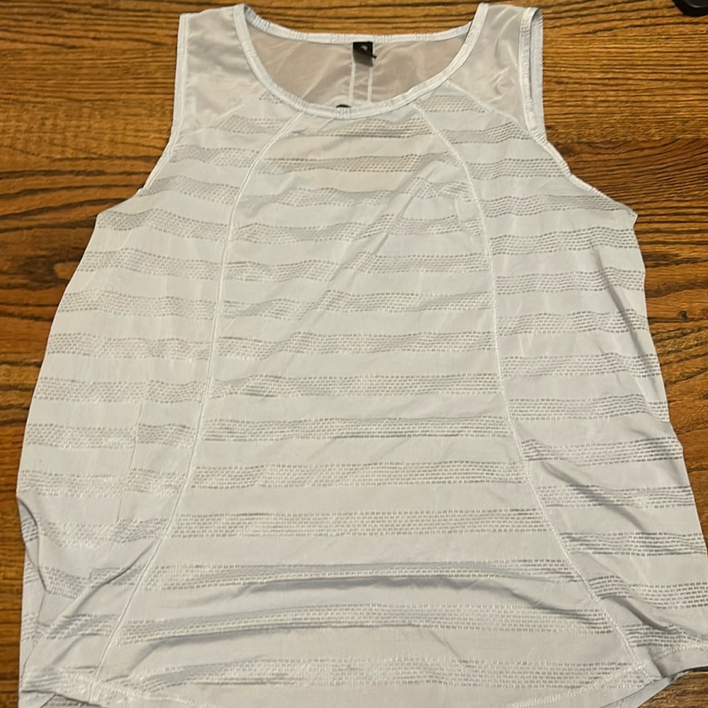Light blue athletic tank top. Size medium.